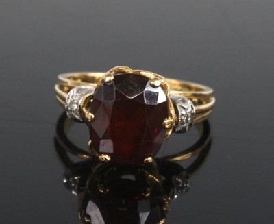 Lot 2169 - A yellow and white metal, garnet and diamond...