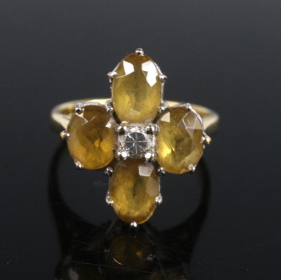 Lot 2200 - A yellow and white metal quatrefoil cluster...