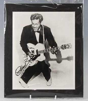 Lot 1372 - Chuck Berry, a 25 x 20cm black and white...