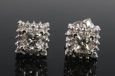 Lot 2228 - A pair of 18ct white gold diamond square...