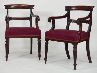 Lot 2413 - A pair of George IV mahogany barback elbow...