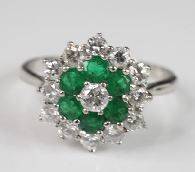 Lot 2212 - A white metal emerald and diamond reverse...