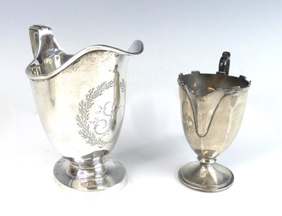 Lot 2115 - A George III silver pedestal cream jug, having...
