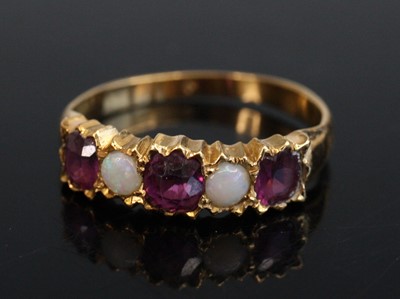 Lot 2168 - An Edwardian yellow metal, garnet and opal set...
