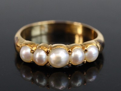 Lot 2177 - A Victorian yellow metal and pearl half-hoop...