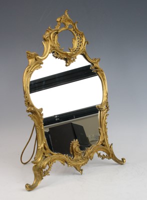 Lot 2273 - A Rococo Revival gilt bronze easel dressing...