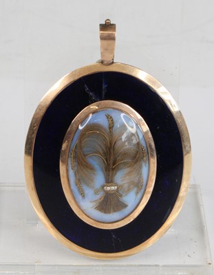Lot 2165 - An early Victorian yellow metal mourning...