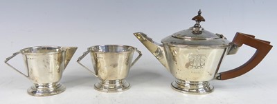 Lot 102 - An Art Deco silver bachelors three-piece tea...
