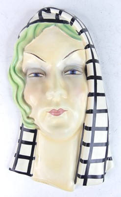 Lot 24 - An Italian pottery wall mask, modelled as a...