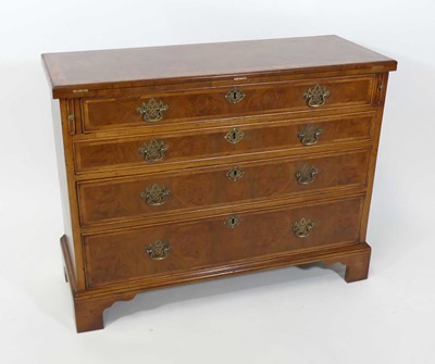 Lot 2479 - A figured walnut bachelors chest in the early...