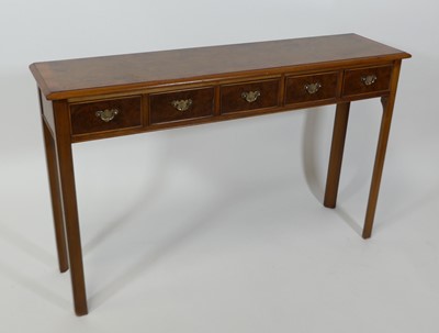 Lot 2470 - A figured walnut five-drawer hall table, in...