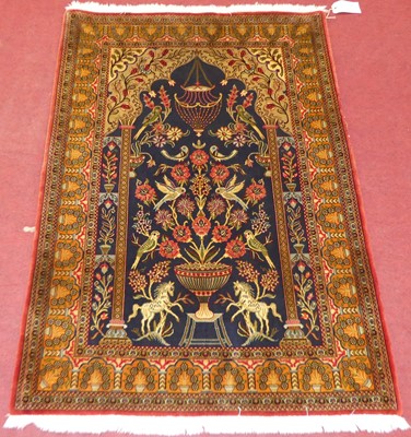 Lot 1148 - A Persian blue ground Tabriz prayer rug, with...