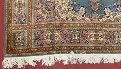 Lot 1144 - A Turkish Ladik turquoise ground rug, with...