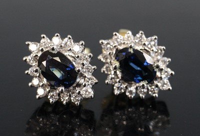Lot 2186 - A pair of yellow and white metal, sapphire and...