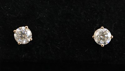 Lot 2227 - A pair of yellow metal diamond single stone...