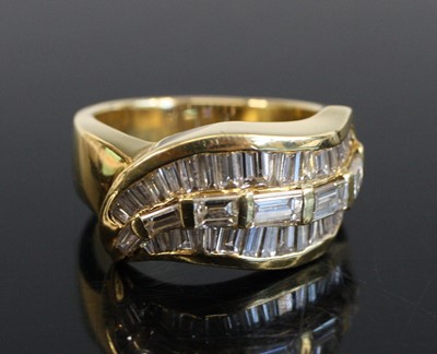 Lot 2215 - A yellow metal swag shaped diamond half...