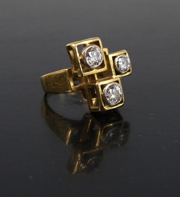Lot 163 - A yellow metal abstract diamond dress ring...