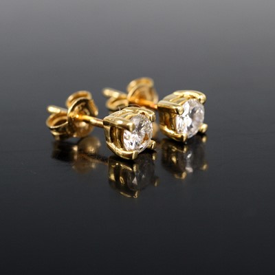 Lot 2003 - A pair of yellow metal diamond single stone...