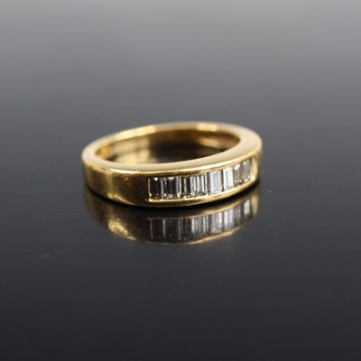 Lot 2004 - A yellow metal diamond half hoop eternity ring...