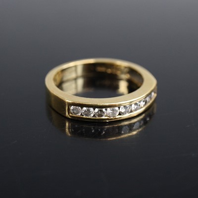 Lot 2008 - An 18ct yellow gold diamond half eternity ring...