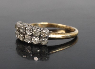 Lot 2198 - A yellow metal diamond half eternity ring,...
