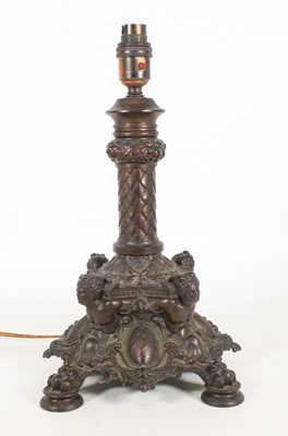Lot 18 - A reproduction bronzed metal table lamp in the...