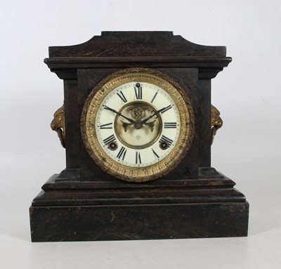 Lot 25 - A late 19th century metal cased mantel clock,...