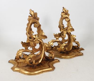Lot 36 - A pair of carved gilt wood wall brackets, in...