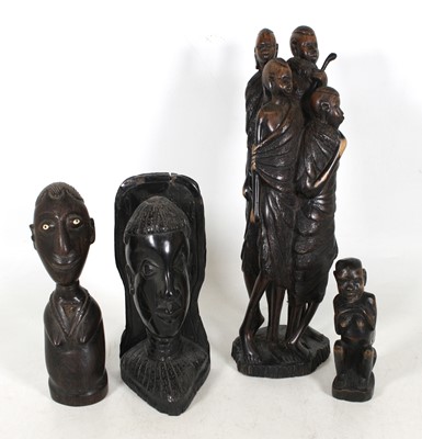 Lot 38 - An African carved hardwood figure group of...