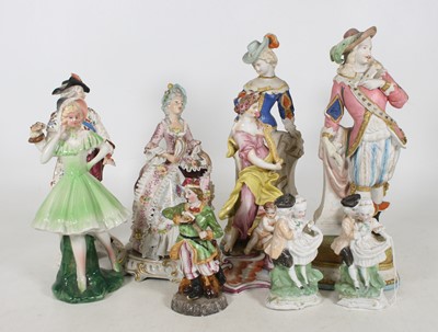 Lot 41 - A collection of figures, to include a pair of...