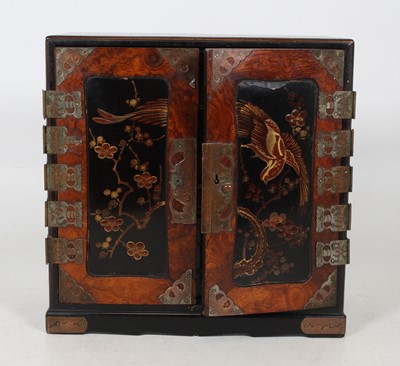 Lot 43 - A Japanese elm and black lacquered table...