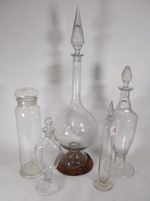 Lot 61 - A large clear glass chemist's bottle, having a...