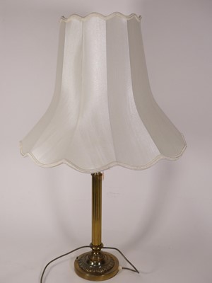 Lot 62 - A contemporary brass table lamp in the form of...