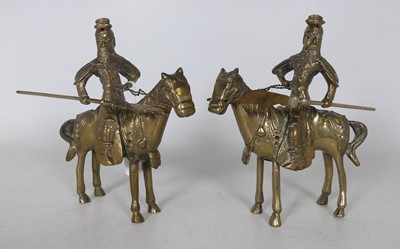Lot 76 - A pair of reproduction Chinese brass figures...