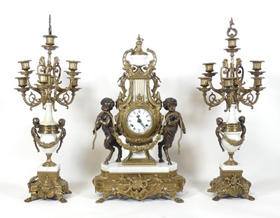 Lot 92 - A reproduction French three-piece clock...