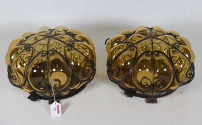 Lot 96 - A pair of metal mounted amber glass ceiling...
