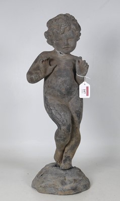 Lot 107 - A lead figure of a putti, modelled standing...