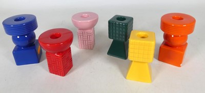 Lot 131 - A set of six multi coloured geometric pottery...