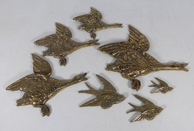 Lot 135 - A graduated set of four brass duck wall...