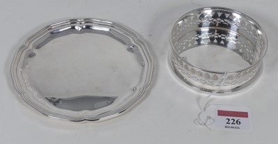 Lot 226 - A modern silver bottle coaster of pierced...