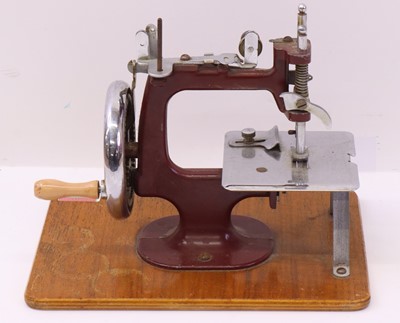 Lot 67 - Essex MK-1 miniature sewing machine, in maroon,...