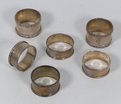 Lot 235 - A pair of Edwardian silver napkin rings, each...