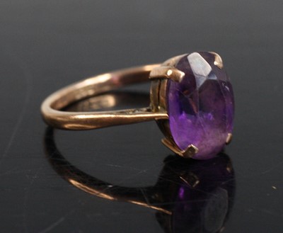 Lot 251 - A modern 9ct gold oval cut amethyst set dress...