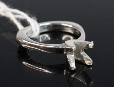 Lot 255 - A modern white metal solitaire ring (lacking...