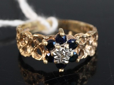 Lot 259 - A modern 9ct gold sapphire and diamond point...