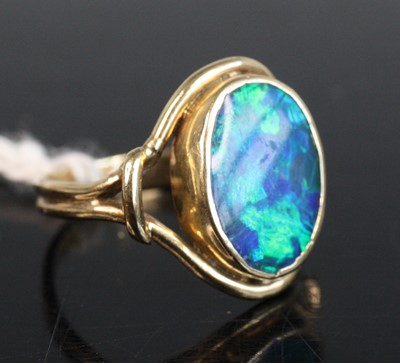 Lot 264 - A yellow metal opal doublet set dress ring on...