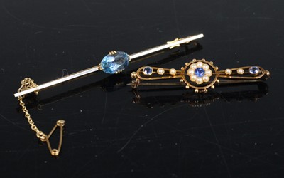 Lot 269 - An 18ct gold platinum faced and blue topaz set...