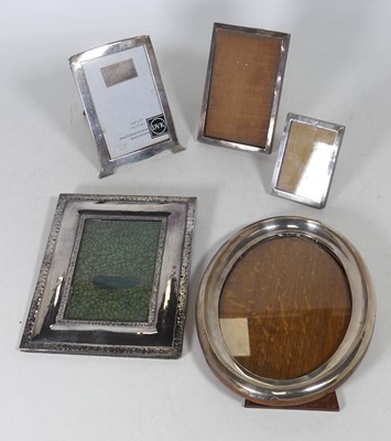 Lot 169 - A silver-clad easel photograph frame, of oval...