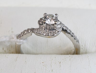 Lot 274 - A modern 18ct gold diamond set dress ring,...