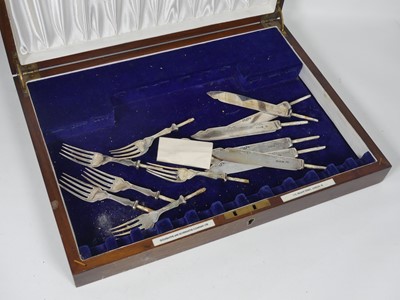 Lot 332 - A set of six George V silver fish knives and...